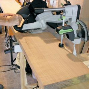 To perform the mitre cut ensure the wood is adequately supported. Saw smoothly and consistently.